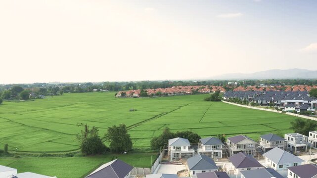 House and residential land development in San Sai District, Chiang Mai, Thailand, shot in April 2021. Agricultural land being transformed into modern housing estates and residential communities.