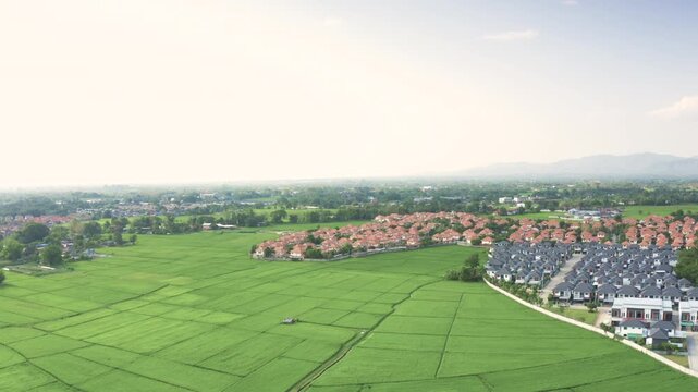 Land and property development illustrates expansion of Chiang Mai real estate market with new houses being built to meet rising demand from local residents. Area of living and real estate investment.