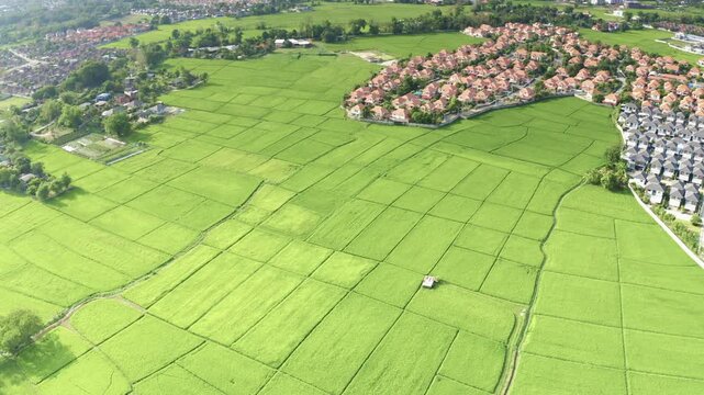 Land and house in residential projects in San Sai District, Chiang Mai, Thailand, shot in April 2021. Highlight new home construction, land investment, housing development and urban expansion.