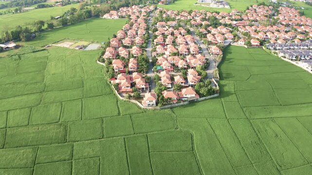 Aerial view of house construction and residential land development in San Sai District, Chiang Mai, Thailand, shot in April 2021. Rrepresents growing real estate market in Chiang Mai suburban areas.