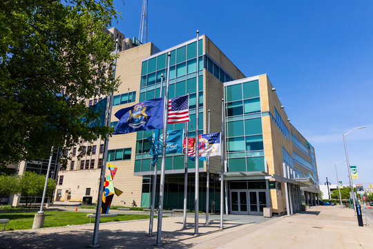 Wayne State University campus building with flags in Detroit