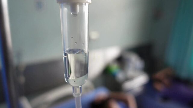 close up equipment in clinic background 4K Intravenous drip in Smooth movement experienced assistant treating a patient Dripping medical perfusion