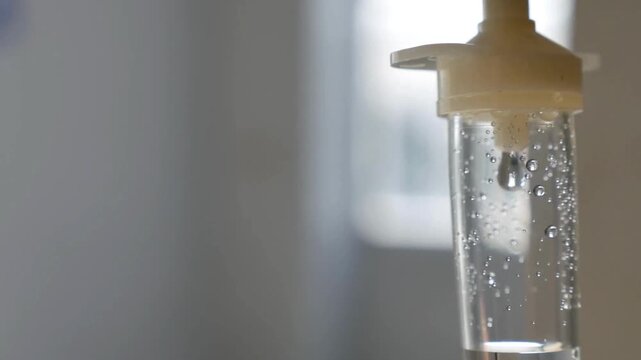 background Closeup of IV drip in hospital for treating patients in the hospital Concept of healthcare Saline IV drip dropper to a operation healthcare