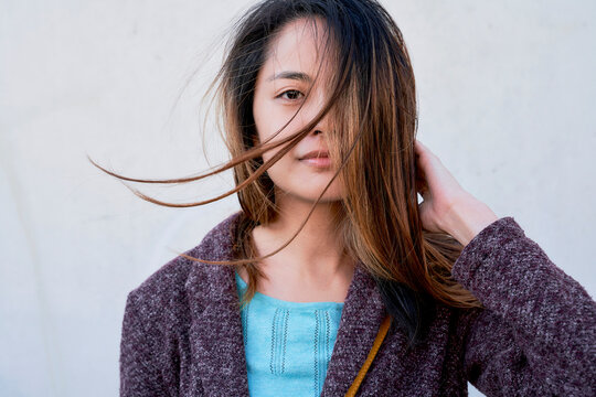 Portrait of woman with windswept hair