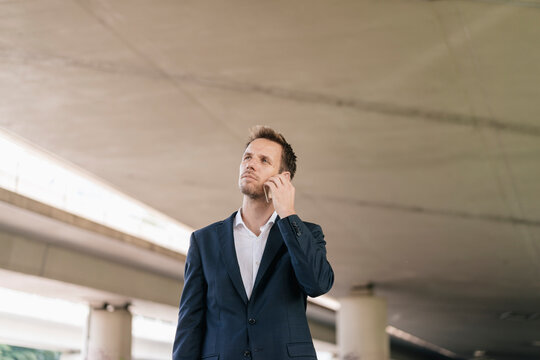 Businessman using futuristic smartphone