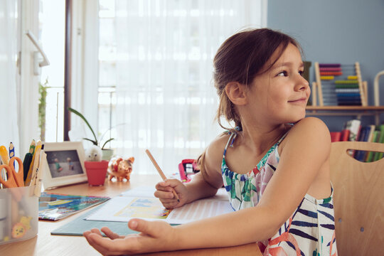 Girl doing her schoolwork at home