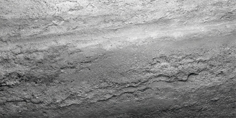 A black and white abstract landscape of natural stone and snow on the road where the winter texture meets a frozen river shore under a vast outdoor sky © PIXEL