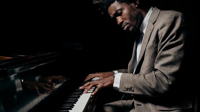 Focused pianist performing expressive jazz improvisation on grand piano in dark studio setting illuminated by dramatic cinematic lighting with rich live concert atmosphere