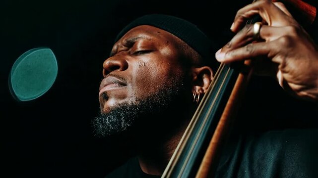 Emotional double bass player performing deep jazz melody on stage under soft blue spotlight capturing intimate moment of concentration and musical passion in atmospheric club