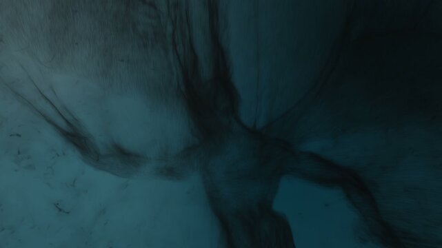 3d animation of an evil creature scouting in the shadows, built from particles