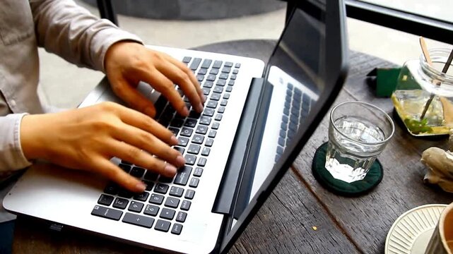 Hands Coding on Laptop, Man's Hands Coding on Laptop CLOSE UP anonymous man sitting at desk late at night, Rear view male coding on laptop screen.