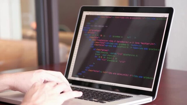 Close up of freelancer's hands typing code on laptop Web application development. programming and . software, developer. Develop project software UHD