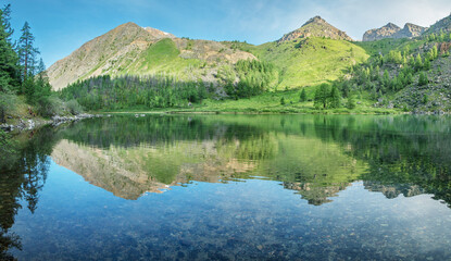 Fototapeta premium Wild mountain lake on a summer morning, summer greens, picturesque reflection