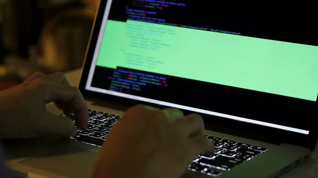 screen full of code in real time Extreme close-up human hands. Closeup coding on AI chatbot coding, working hard at night overtime on computer. 4K HD