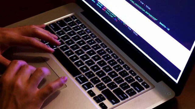 Close up of freelancer hands typing app using digital laptop computer. typing a code on screen hands type html code and programming on screen laptop.