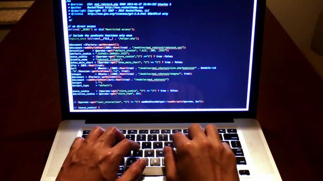 Close-up of human hands typing on laptop keyboard at home Man programmer writes code IT start up concept, Man coding on laptop of developer hands