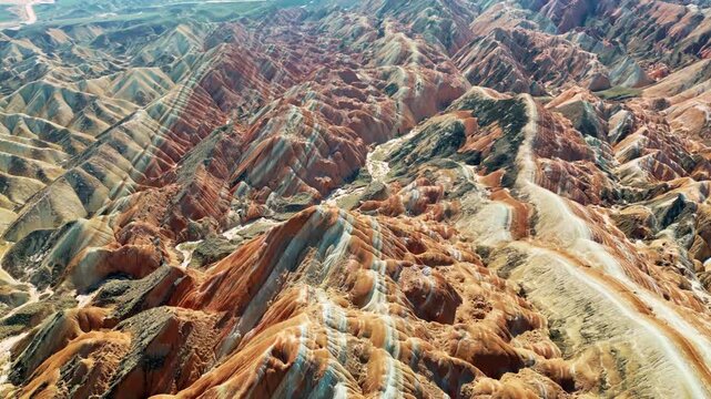 Aerial drone view of eroded sandstone ridges in Zhangye Danxia National Geopark, Gansu, China