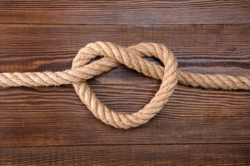  Thick rope on wooden background