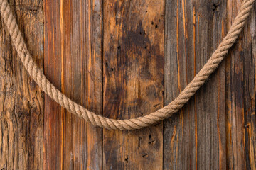 Obraz premium Thick rope on wooden background