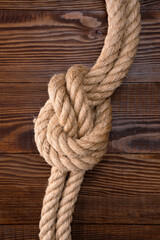 Fototapeta premium Thick rope on wooden background