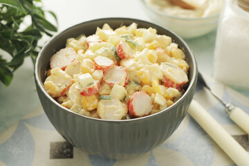 A bowl with traditional crab salad	
