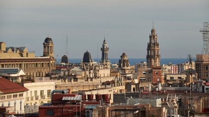 Fototapeta premium Barcelona skyline with historic rooftops and Mediterranean Sea on horizon