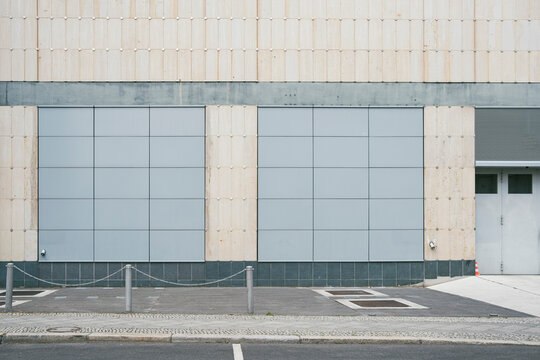 Industrial building facade and urban wall with minimal geometry and textured surfaces creating a neutral architecture background for concepts