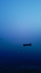 Naklejka premium Minimal Boat on Calm Blue Ocean Serenity Landscape