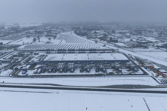 Aerial view of a large data center and solar park, experiencing winter weather conditions, Winschoten, Netherlands