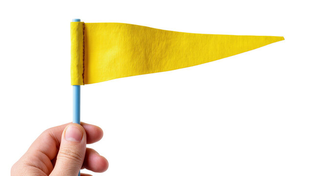 Isolated hand holding a small yellow triangular pennant flag ready for marking a goal