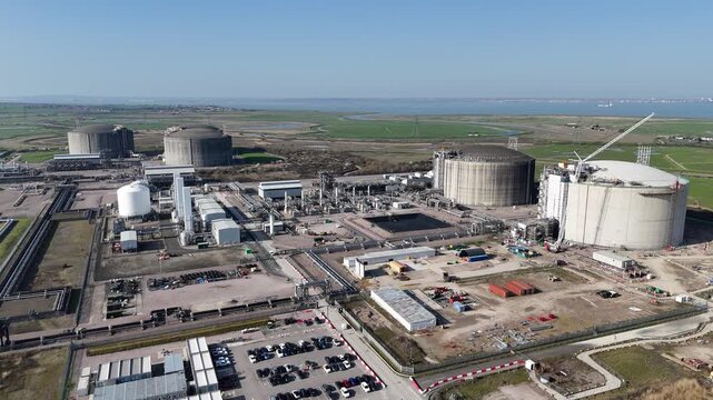 Panning drone aerial Grain LNG Import Terminal, Isle of Grain, Kent, UK