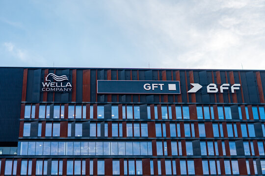 Brama Miasta office building in Lodz with Wella Company, GFT, and BFF logos, corten steel facade, business architecture in New Center of Lodz, class A offices, industrial design, corporate headquarter