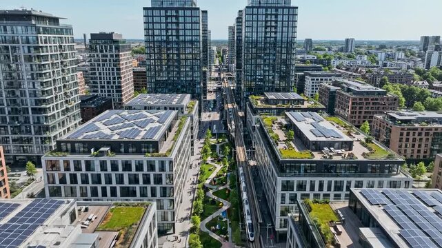 Video of high density mixed use neighborhood captured in aerial perspective, contemporary city planning and transit oriented development visual for architecture and investment media.