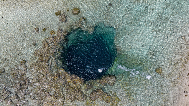 Aerial view of Koko Oana underground lava tube in Anaa atoll lagoon