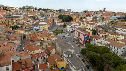 Obraz premium Panorama of a historic Mediterranean village featuring a large public square with a green lawn. It is Rionero in Vulture, a small town in province of Potenza, Basilicata, Italy. 