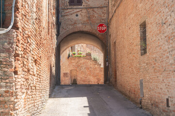 Fototapeta premium Close view of aged brick wall texture in historic european town