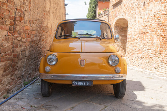 Baccoleno, Italy, 05.07.2026, Yellow Vintage Car in Old Town