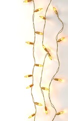 A string of glowing golden christmas lights hanging vertically against a clean white background