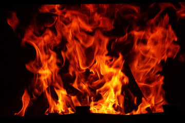 Obraz premium Flame of burning wood in fireplace