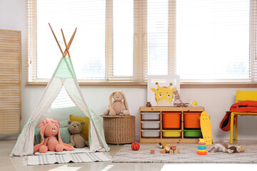 Interior of children's playroom with play tent and toys © Pixel-Shot