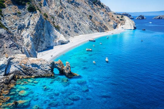 Aerial view of the beautiful Lalaria beach at Skiathos Island, Sporades, Greece, with the natural rock arch and turquoise shining sea