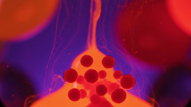 Vibrant abstract art with colorful liquids and swinging pendulums in motion