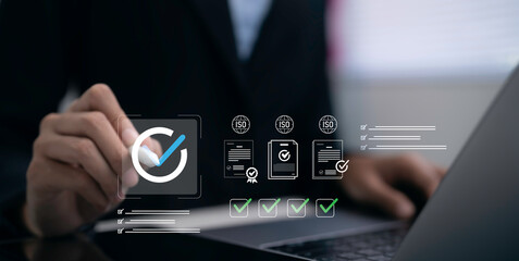 Businesswoman verifying quality standards with digital checklist and certification interface. Quality control audit compliance management ISO standard approval and business verification concept © Toowongsa