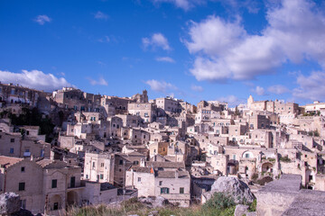 Naklejka premium Carved into stone and shaped by centuries, Matera rises from the rocks of southern Italy like a timeless masterpiece.