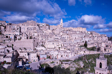 Naklejka premium Carved into stone and shaped by centuries, Matera rises from the rocks of southern Italy like a timeless masterpiece.
