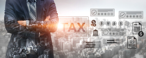 Confident businessman stands with arms crossed in front of financial graphics related to tax and economic growth, showcasing a modern urban skyline backdrop. Gantry © InfiniteFlow