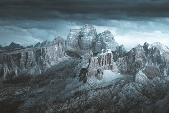 View of jagged, rocky peaks under a brooding sky, a monochrome landscape conveying a sense of stark grandeur and isolation, Cortina d'Ampezzo, Veneto, Italy.