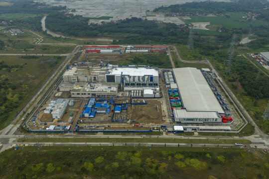 Aerial view of large scale data center infrastructure project under construction, emphasizing connectivity, cloud computing, technology, and information processing, Beijing, China