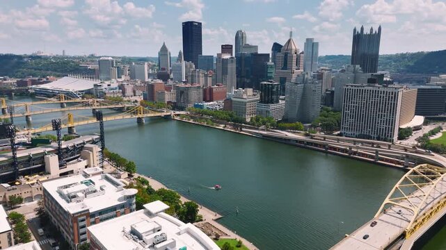 Aerial view of Pittsburgh showing bridges, PNC Park, and the riverfront. Perfect for corporate, travel, or cinematic footage.