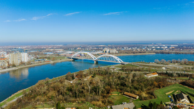 Aerial view of the Duga bridge over the blue Danube river, connecting the cityscape, Petrovaradin Fortress, Petrovaradin, Vojvodina, Serbia.